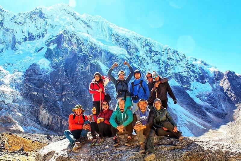 Salkantay mountain trail through cloud forest with diverse ecosystems, hanging bridges over rivers, and panoramic views of snow-capped peaks and lush valleys