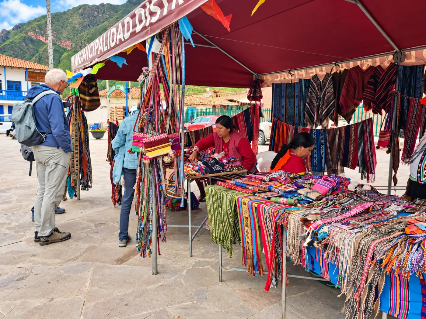 Handicrafts, textiles and traditional clothing at a stall in Cusco
