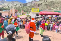 Christmas celebration with children and families outside Saylla District Municipality, 2024