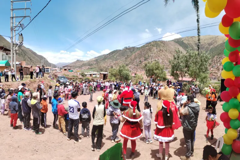 Children and families enjoying a Christmas activity with festive characters in Saylla, 2025