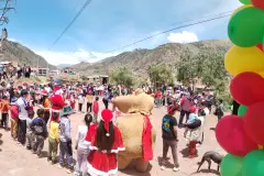 Participants gathered in a circle during Christmas campaign games in Saylla, 2025