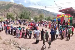 Christmas community gathering beside the decorated stage in Saylla, 2025