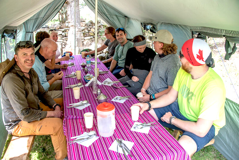 Traditional Peruvian feast spread on colorful textile blanket